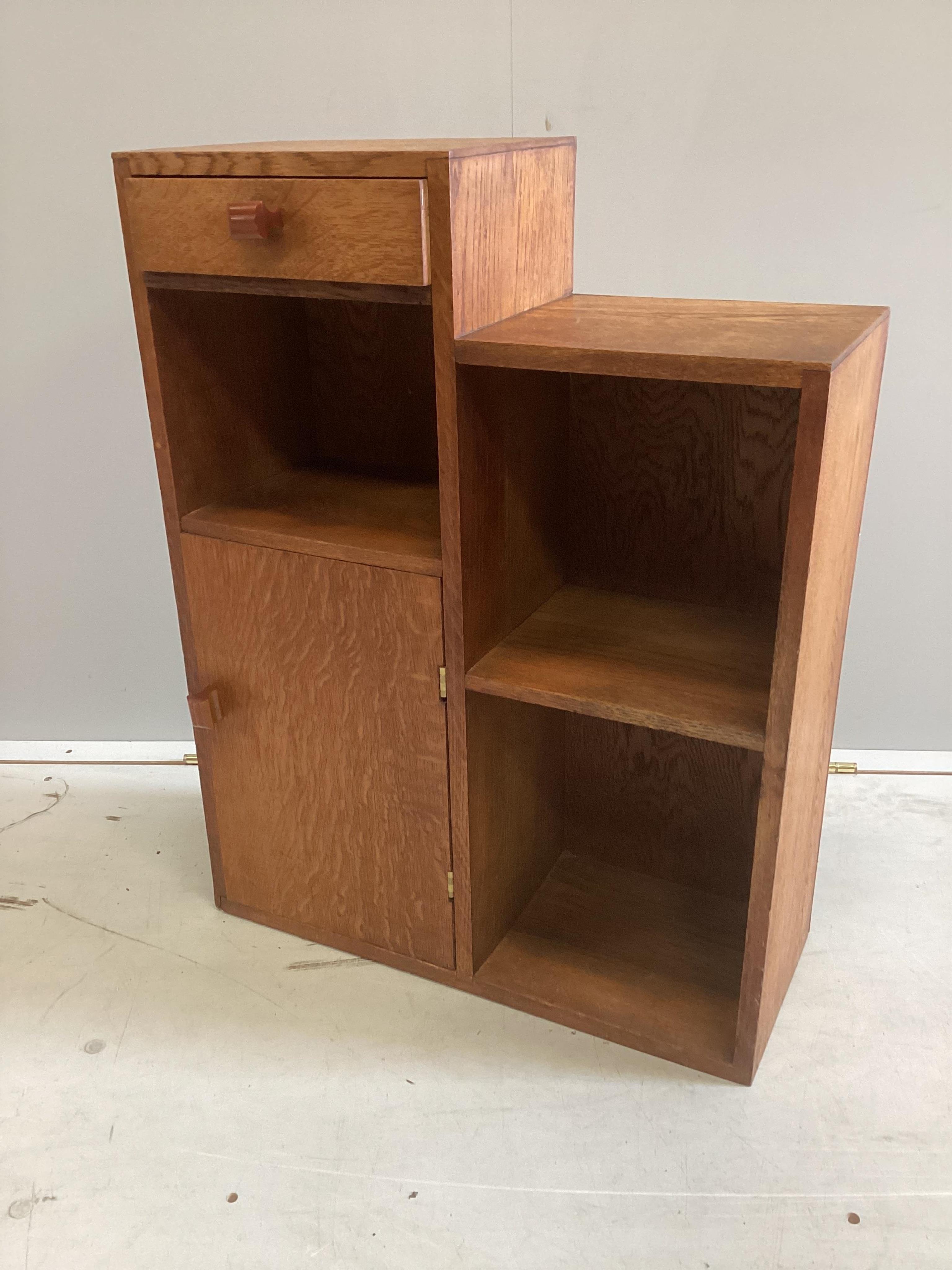 A mid century Betty Joel style oak bedside cabinet, width 52cm, depth 20cm, height 69cm. Condition - fair